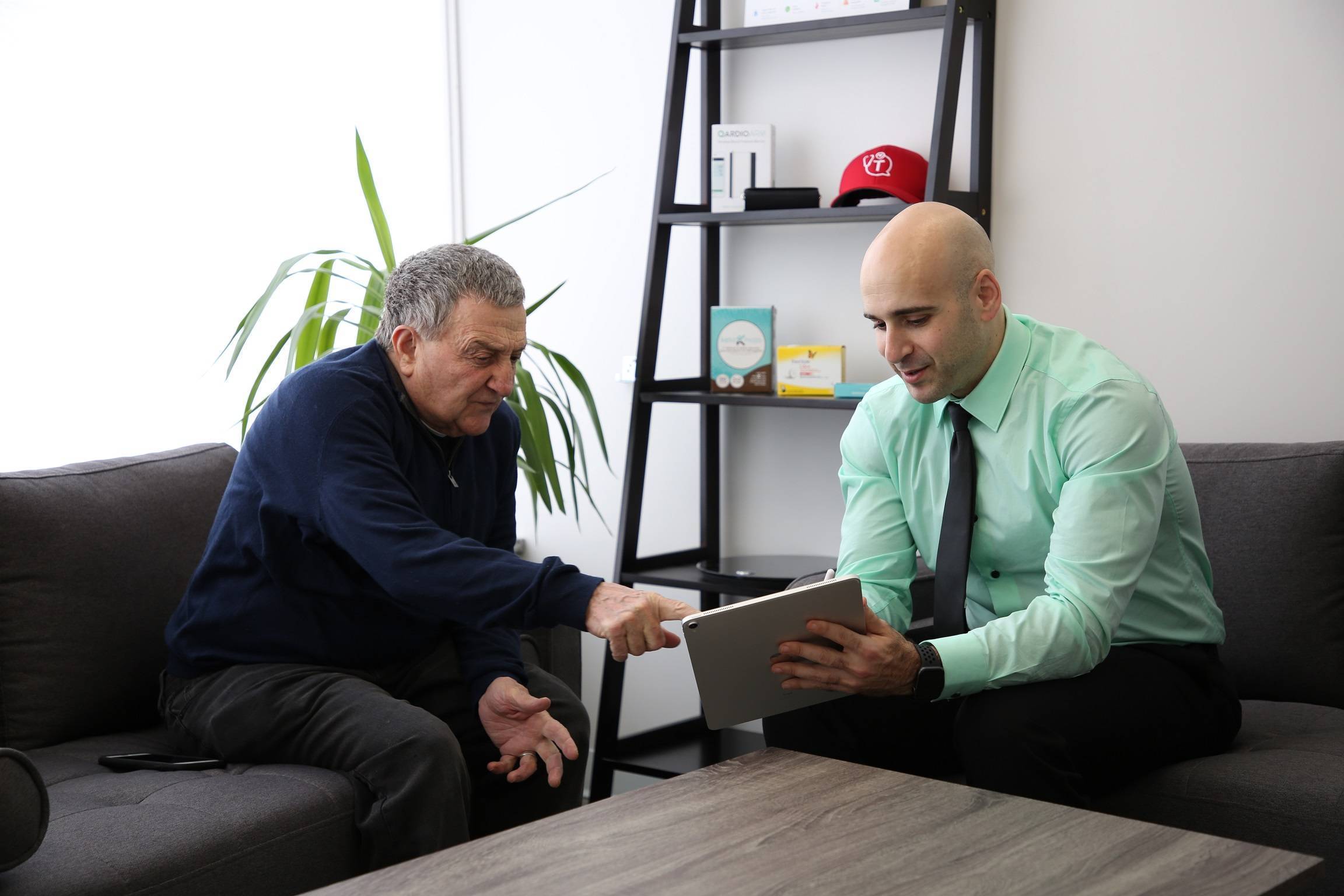 Dr. Tro Kalayjian consults with a patient in his office prior to the COVID-19 threat. Kalayjian's office is fully equipped to treat patients using remote monitoring tools, ensuring continuity of care.